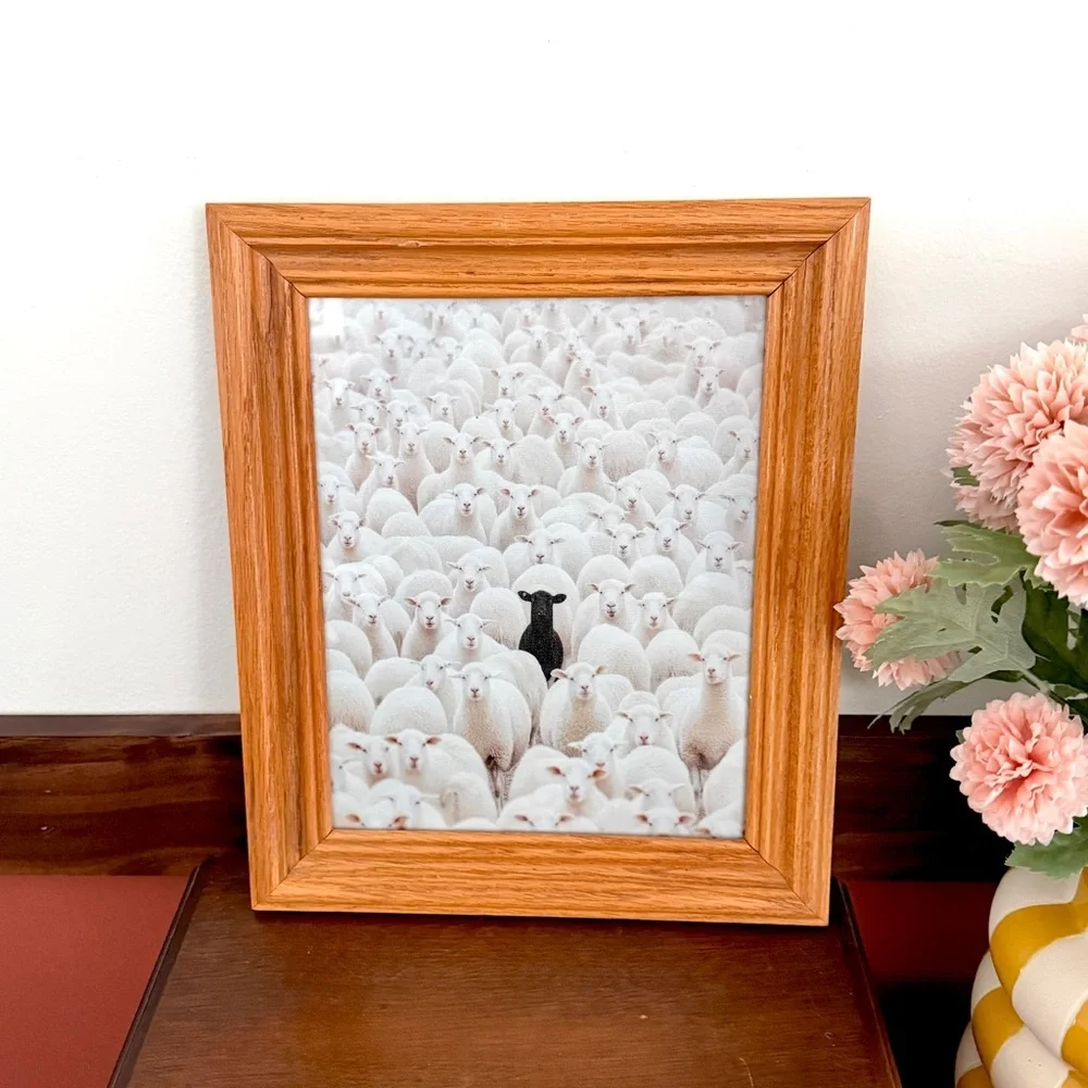 Black Sheep in a Crowd of White Lambs Canvas Art Print Vintage Wood Framed Art